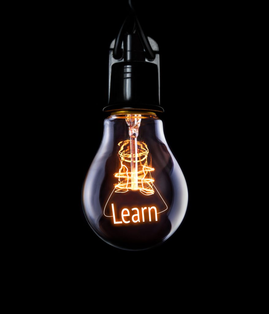 A hanging lightbulb with the word Learn showing.